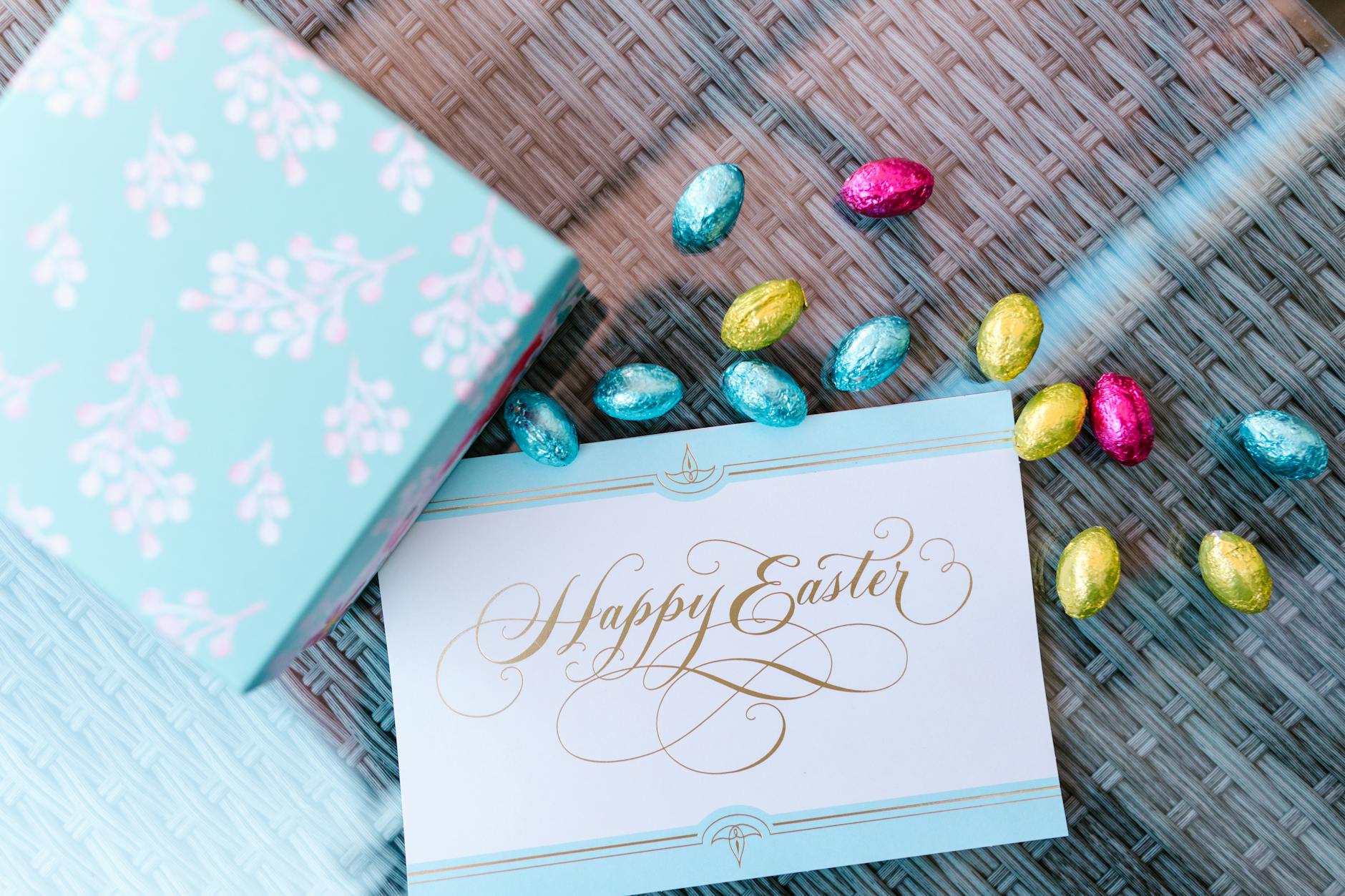 easter card and chocolate eggs in silver foils